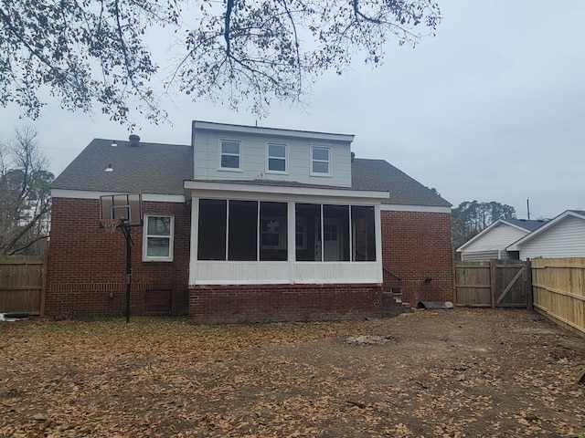 back of property featuring a sunroom