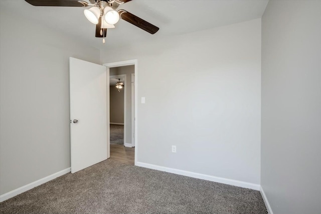 unfurnished bedroom with baseboards, ceiling fan, and carpet flooring