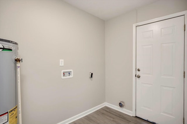 laundry area with washer hookup, light hardwood / wood-style flooring, and water heater