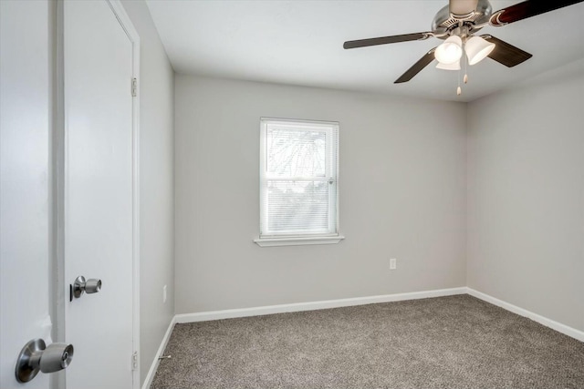 empty room featuring carpet floors and ceiling fan