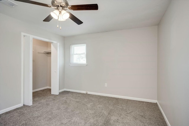 unfurnished bedroom with a closet, ceiling fan, and light carpet