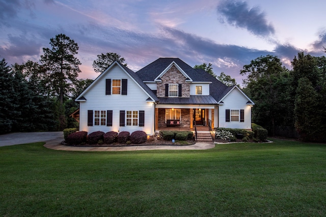 295 River Wind Dr, North Augusta, SC 29841 - view of front of property featuring covered porch, a standing seam roof, a yard, and a metal roof