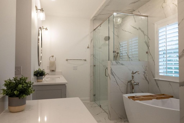 295 River Wind Dr, North Augusta, SC 29841 - bathroom featuring marble finish floors, vanity, a freestanding tub, and a marble finish shower