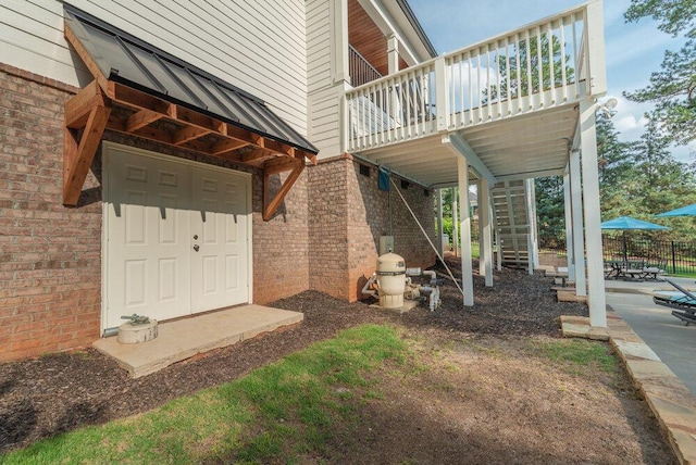 295 River Wind Dr, North Augusta, SC 29841 - entrance to property featuring brick siding, a wooden deck, and a patio area