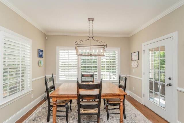 295 River Wind Dr, North Augusta, SC 29841 - dining space with wood finished floors, plenty of natural light, ornamental molding, and a chandelier