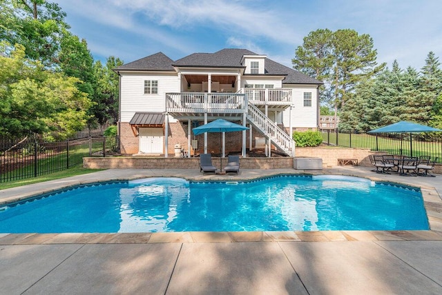 295 River Wind Dr, North Augusta, SC 29841 - view of swimming pool with a wooden deck, stairs, and a patio