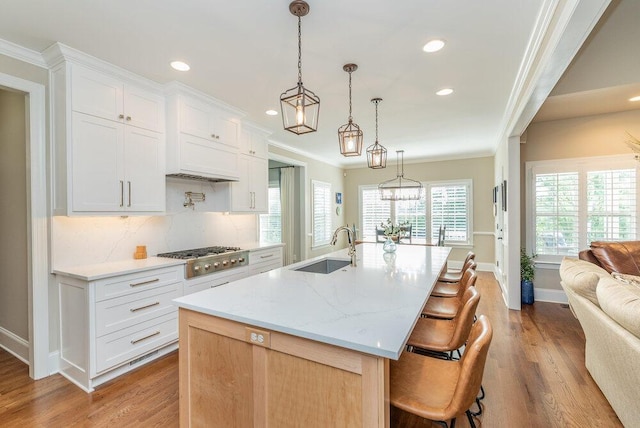 295 River Wind Dr, North Augusta, SC 29841 - kitchen with stainless steel gas stovetop, wood finished floors, recessed lighting, open floor plan, and tasteful backsplash