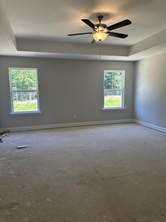 1457 Elias Sta, Thomson, GA 30824 - spare room with a tray ceiling and ceiling fan