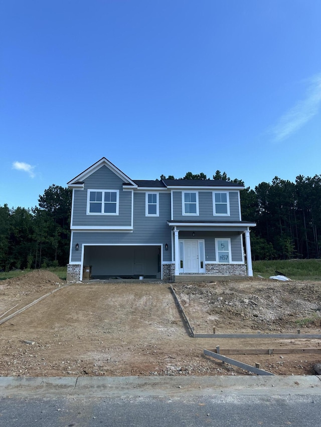 1457 Elias Sta, Thomson, GA 30824 - view of front facade with covered porch and a garage
