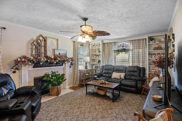 living room featuring plenty of natural light, a textured ceiling, and ornamental molding