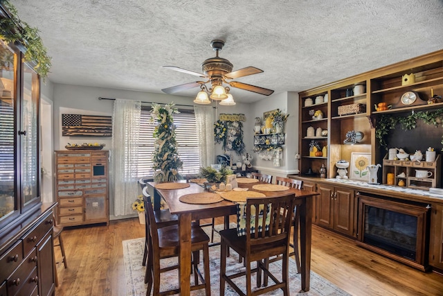 dining room featuring ceiling fan and light wood-type flooring