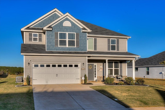 view of front of house with a garage, central air condition unit, and a front yard