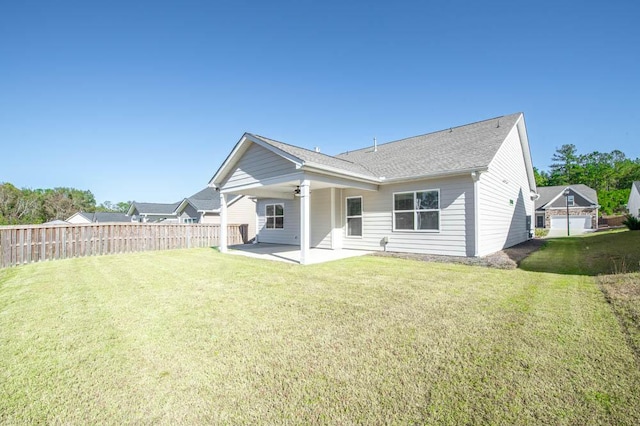 back of property featuring a patio area, ceiling fan, and a yard