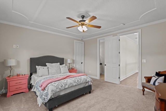 carpeted bedroom with ornamental molding, a ceiling fan, and baseboards