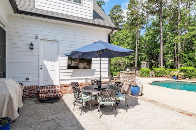 view of patio / terrace with entry steps, area for grilling, and outdoor dining area