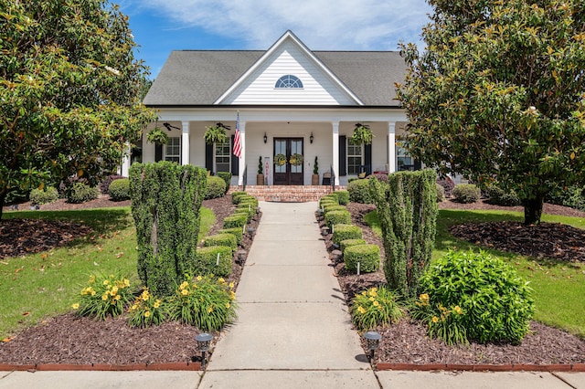 view of front of home with french doors and a porch