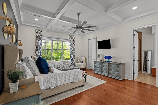 bedroom featuring coffered ceiling, wood finished floors, recessed lighting, beam ceiling, and crown molding