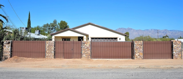 view of gate with a mountain view