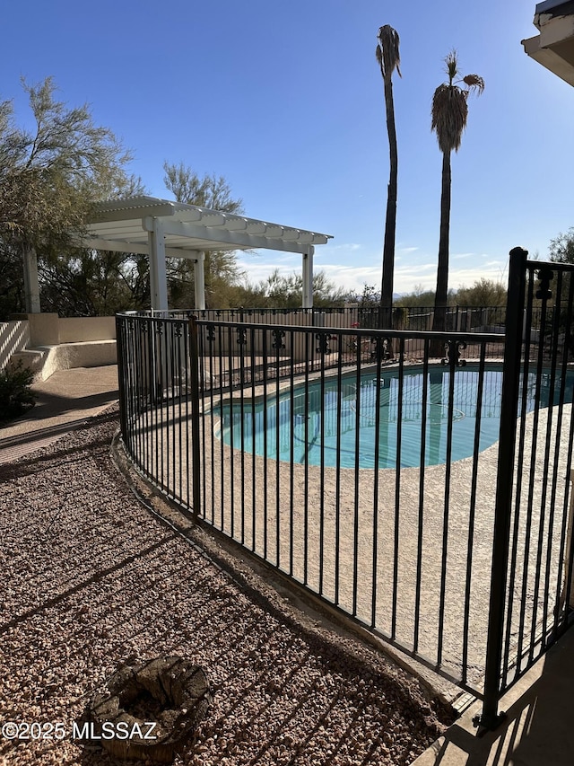 view of swimming pool featuring a patio and a pergola