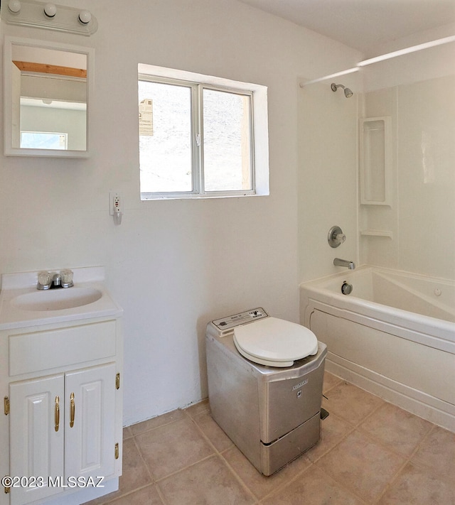 bathroom featuring shower / bathing tub combination, vanity, a healthy amount of sunlight, and tile flooring