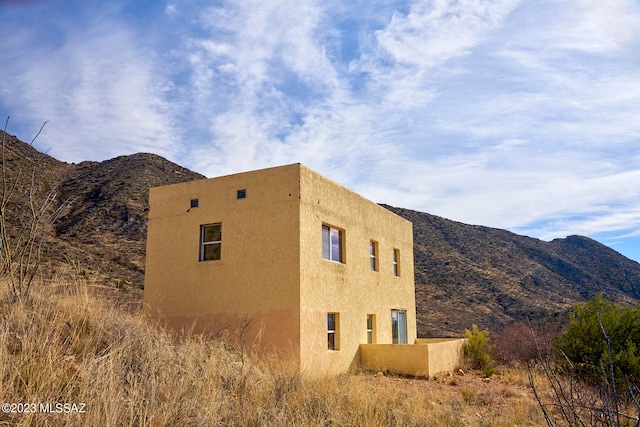 exterior space featuring a mountain view