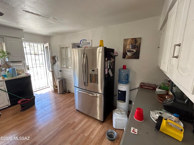 kitchen with white cabinetry, stainless steel refrigerator with ice dispenser, and light hardwood / wood-style flooring