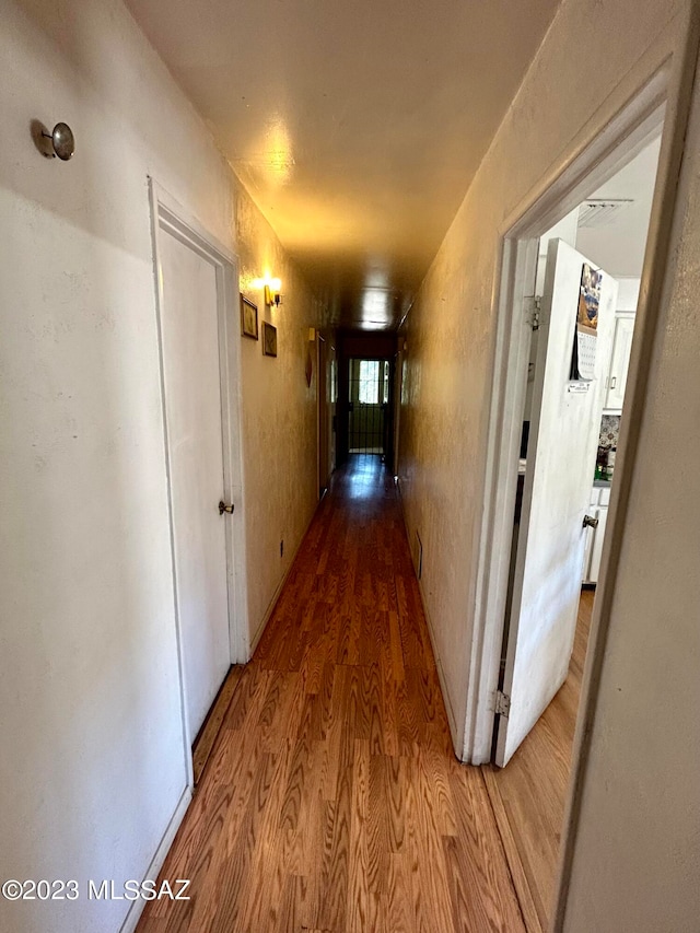 corridor featuring light wood-type flooring