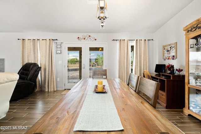 dining room featuring dark wood-type flooring and french doors