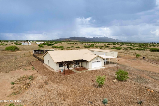 exterior space with a rural view and a mountain view