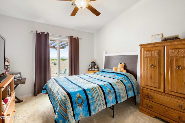 carpeted bedroom with ceiling fan and lofted ceiling