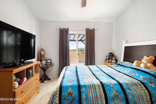 carpeted bedroom featuring ceiling fan