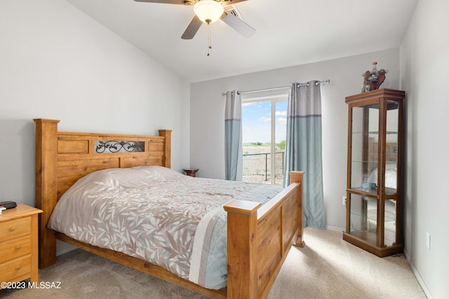 carpeted bedroom featuring ceiling fan and lofted ceiling