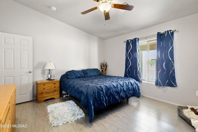 bedroom featuring light hardwood / wood-style flooring and ceiling fan