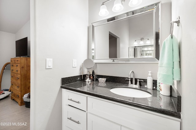 bathroom featuring vanity with extensive cabinet space