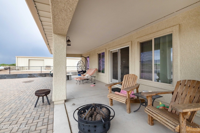 view of patio / terrace with an outdoor fire pit