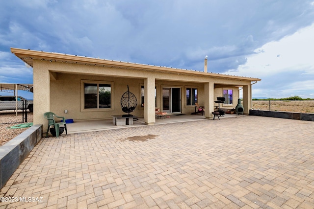 rear view of house with a patio area