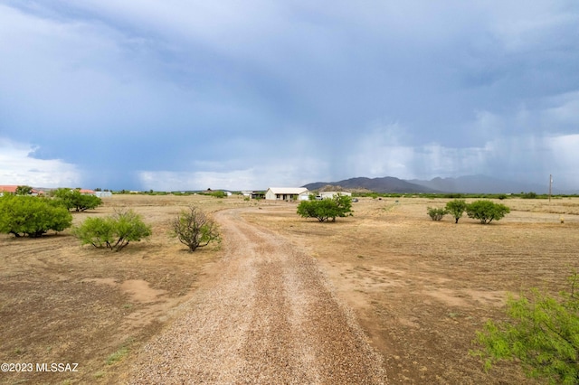 view of road with a mountain view and a rural view