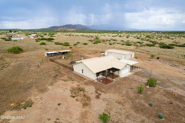 drone / aerial view with a mountain view and a rural view