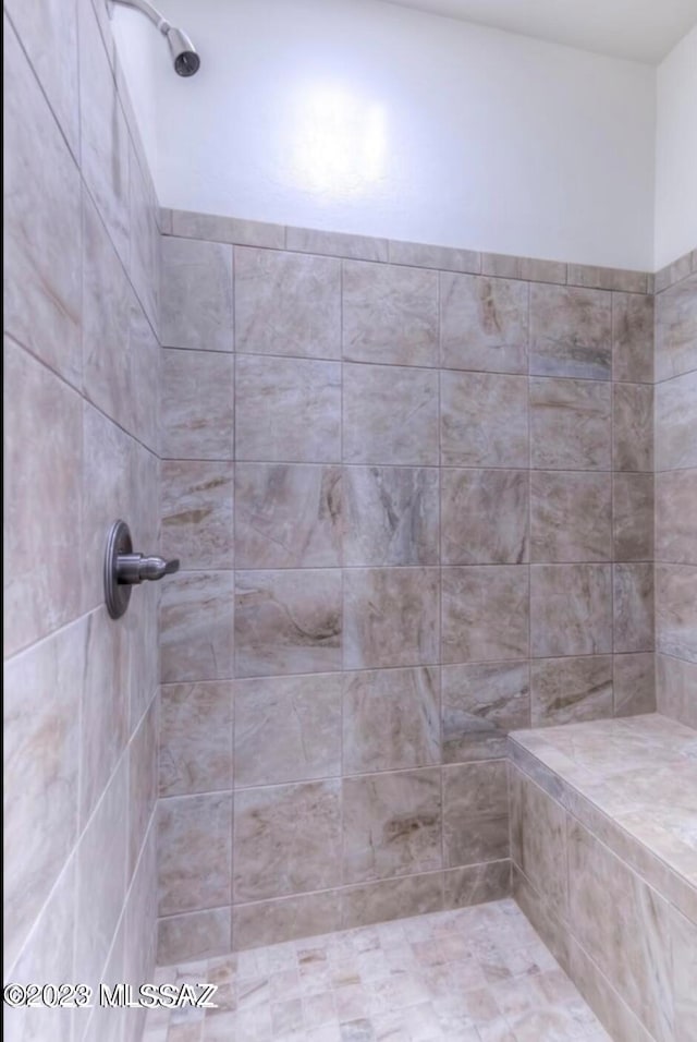 bathroom featuring tiled shower