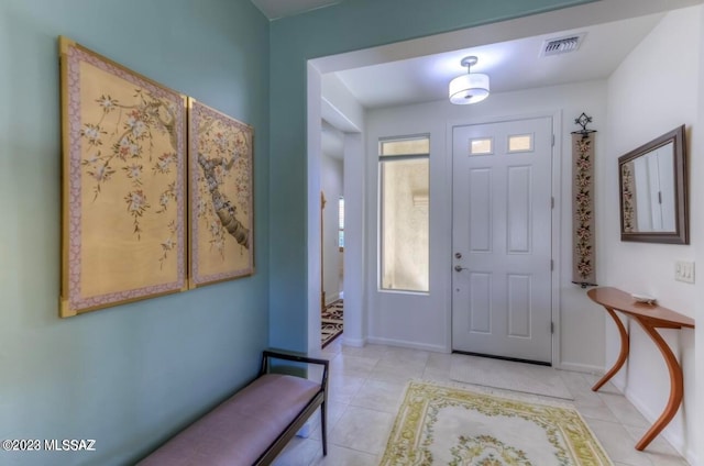 entrance foyer with light tile floors