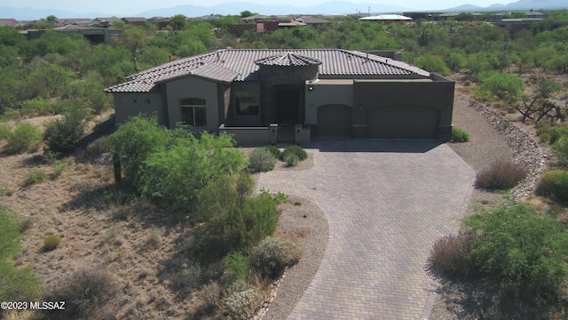 mediterranean / spanish-style house featuring a garage