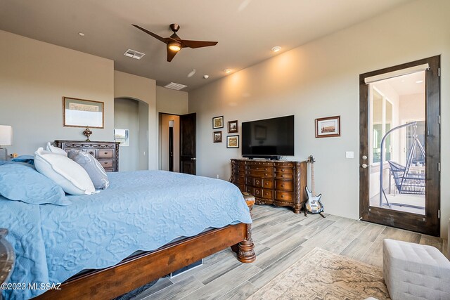 bedroom with ceiling fan, light wood-type flooring, and access to outside