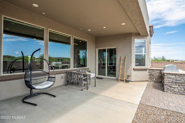 view of terrace featuring exterior kitchen