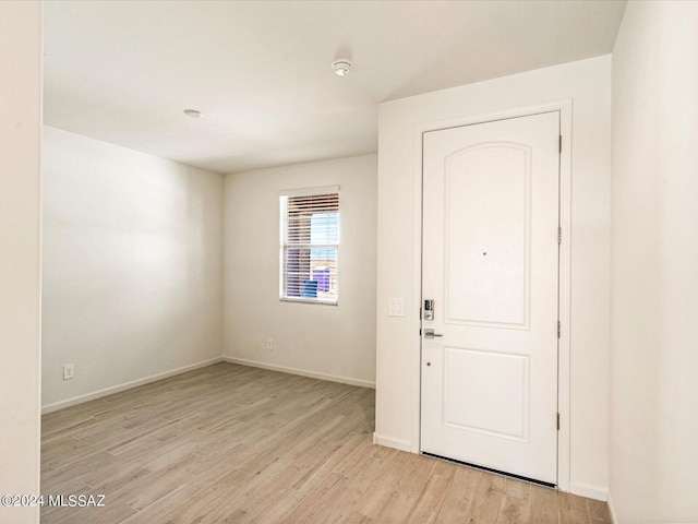 foyer with light hardwood / wood-style floors