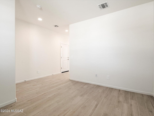 spare room with light wood-type flooring