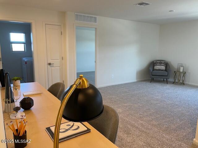 office area featuring carpet flooring and washer / dryer