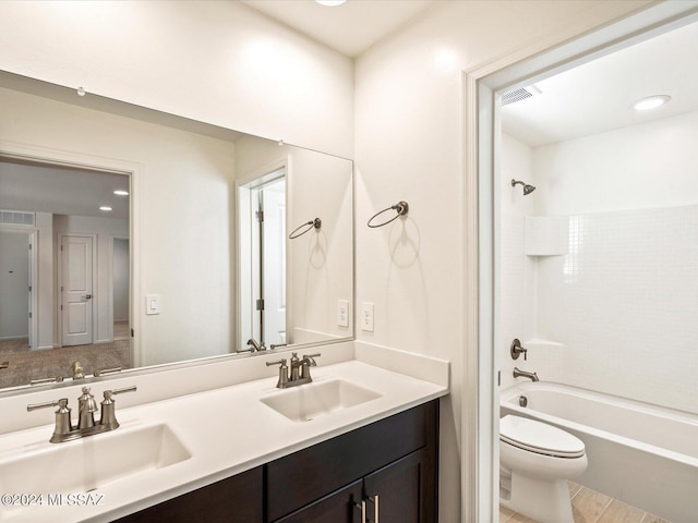 full bathroom featuring vanity, shower / bathtub combination, and toilet