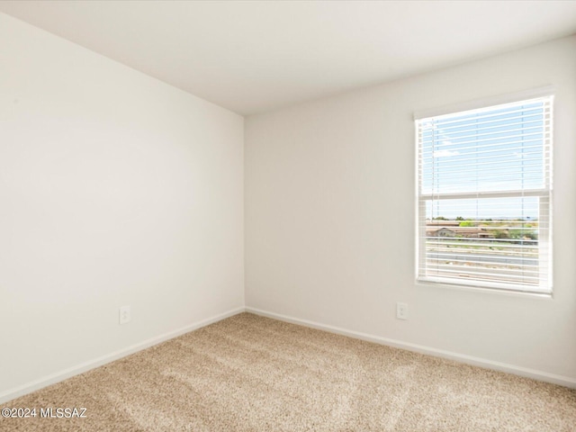 unfurnished room featuring carpet floors