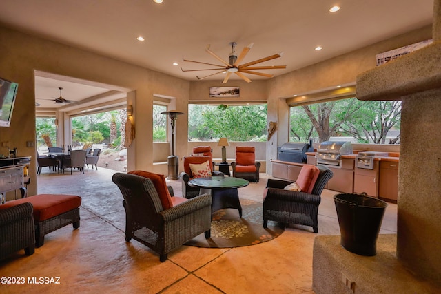 tiled living room featuring ceiling fan