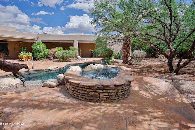 view of pool with a patio